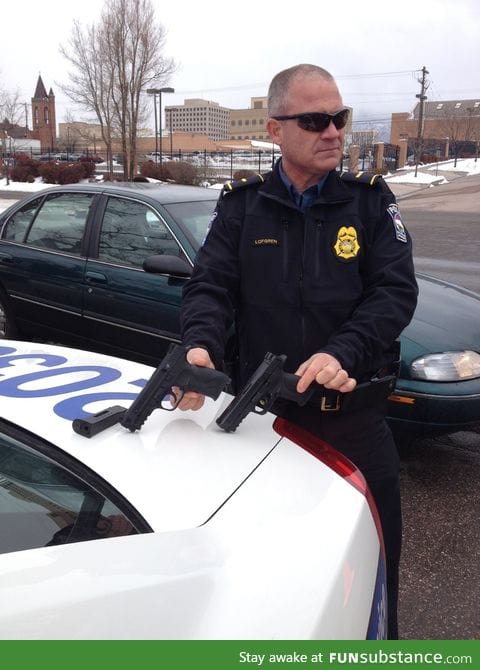 Police Officer compares his firearm to a bb gun recovered during a school fight