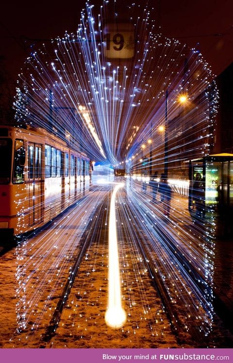 Long exposure of a departing Tram in Budapest covered in 30,000 LED lights