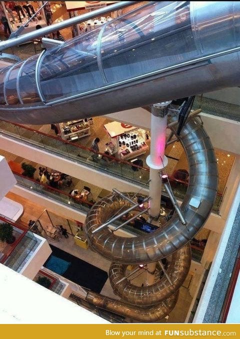 An indoor slide to take you to the bottom floor in a shopping mall in Malaysia