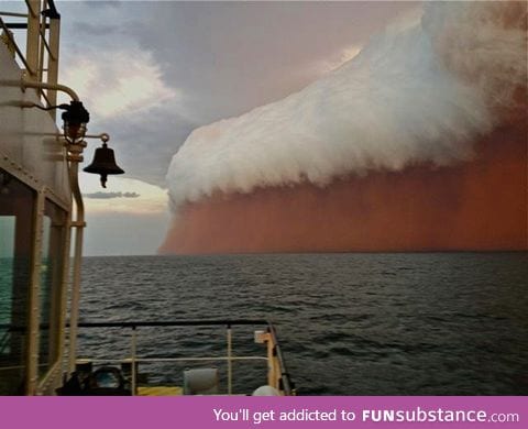 Incredible sight forms when dust storm and rain clouds combine over Indian ocean