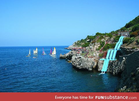 This giant water slide in Italy drops you into the ocean!