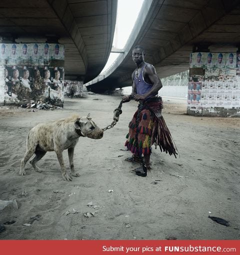 Nigerian dude with his pet hyena