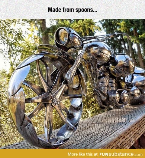 A motorcycle sculpture made entirely out of spoons