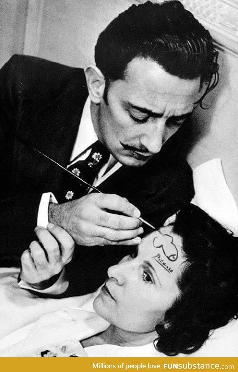 Salvador Dali drawing a pen*s on the forehead of a woman and signing it with Picasso’s