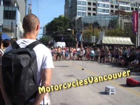 Kid tries to push over Busker in the middle of his performance