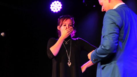 Magician proposes on stage in a rather special way