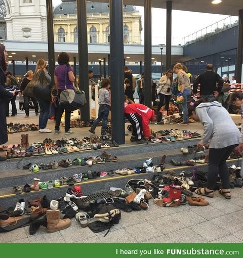 Hungarians bring their shoes to the Budapest train station for arriving migrants