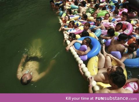 In China, You Can Pay Extra To Get in the uncrowded section of the swimming area