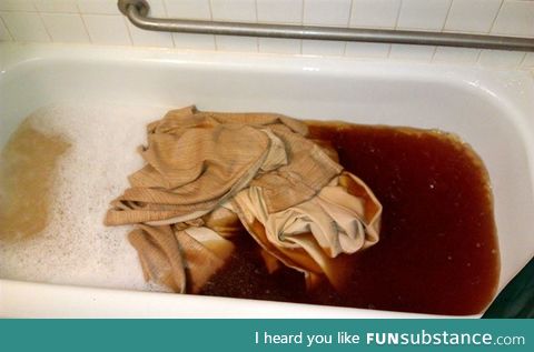 Curtain from the apartment of a smoker after being put in a soap water.