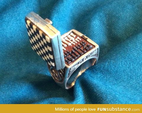 The world's smallest chess set in a ring