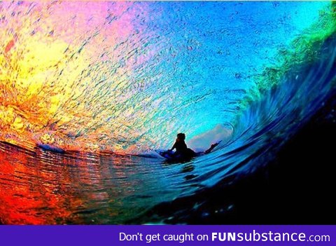 Surfs up! Sunset seen through a wave