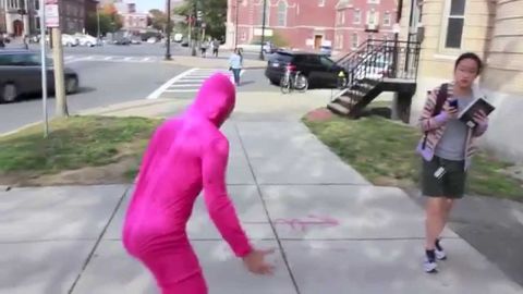 Guy dresses up in pink morph suit, and scares people