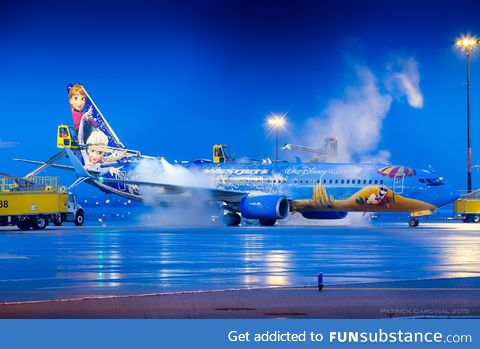 Airport ground crews de-icing a Frozen plane