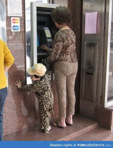 The rare "Urban Leopard" and her cub photographed in their natural habitat
