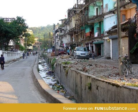 This is the border between India and Bhutan. India is on the right