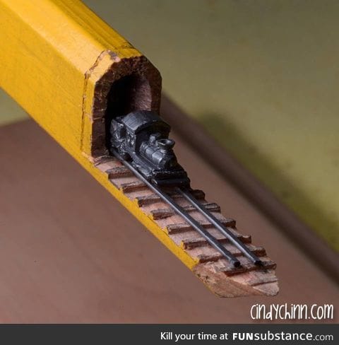 Train carved into the lead of a carpenters pencil... 3/16'th of an inch highBy