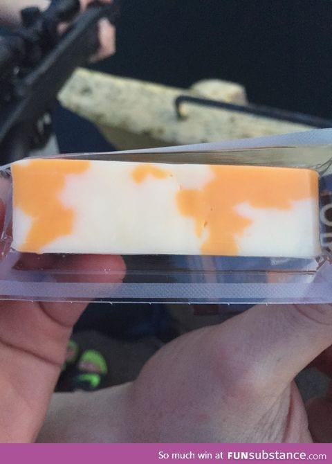 This block of cheese has a very, very crude map of the world on it