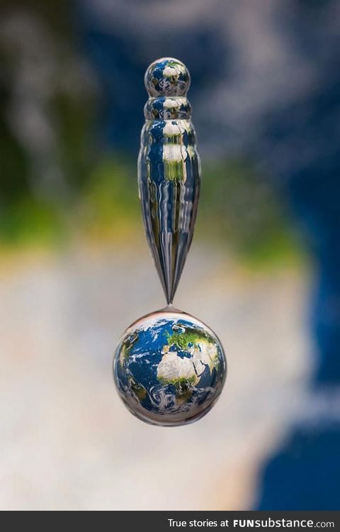 Picture of a water droplet above a map
