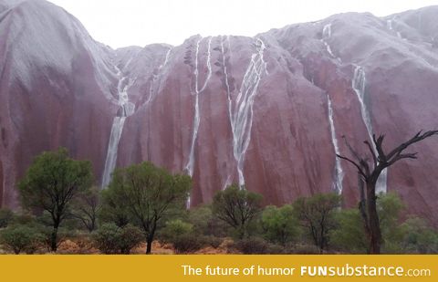 Rain running down Uluru