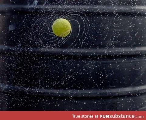 Wet spinning tennis ball