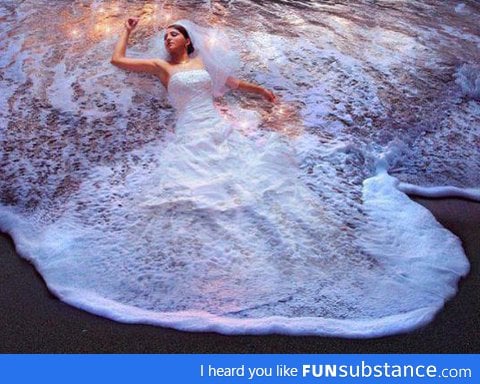 Wedding dress in the waves