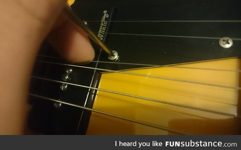 Moving the G-string out of the way so I could screw