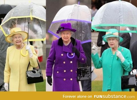 Queen Elizabeth carries her own umbrella, in style