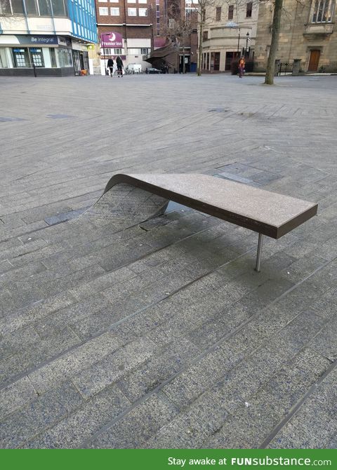 This paving stone curls into a bench to sit on