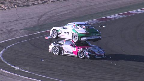 Race cars got into an accident and landed perfectly on top of each other