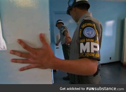 South Korean soldiers hold hands in case they get pulled into the North