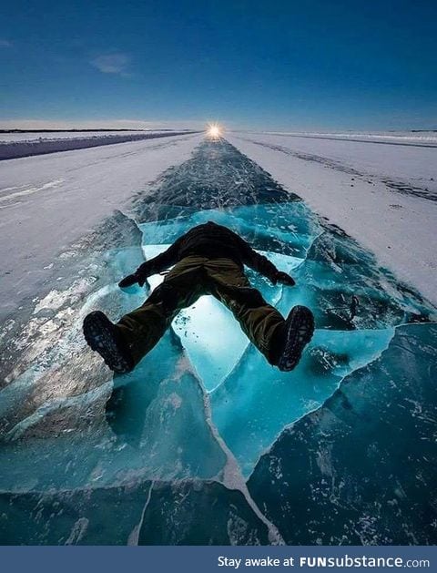 Dude chilling out on the Dettah Ice Road, Yellowknife, Canada