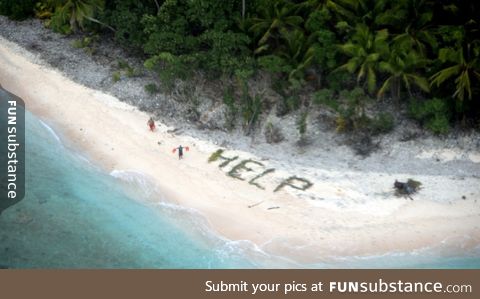 Photo of shipwrecked boaters found on desert island by U.S. Navy aircraft