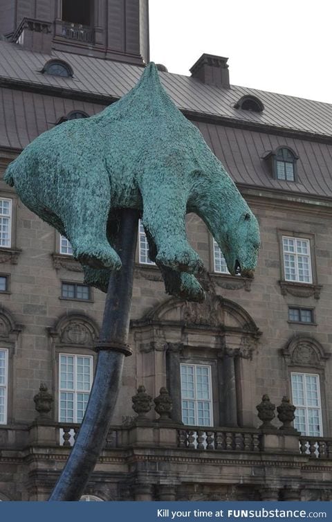 Polar bear statue impaled on a oil supply line, dumped in front of the Danish parliament