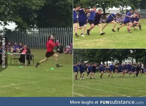 Little boys link arms whilst racing to let the kid with Down's Syndrome (in red) win.