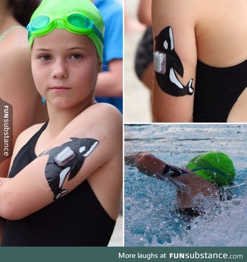 Dad decorates his daughters diabetes device using dollar store tape for her swim meet