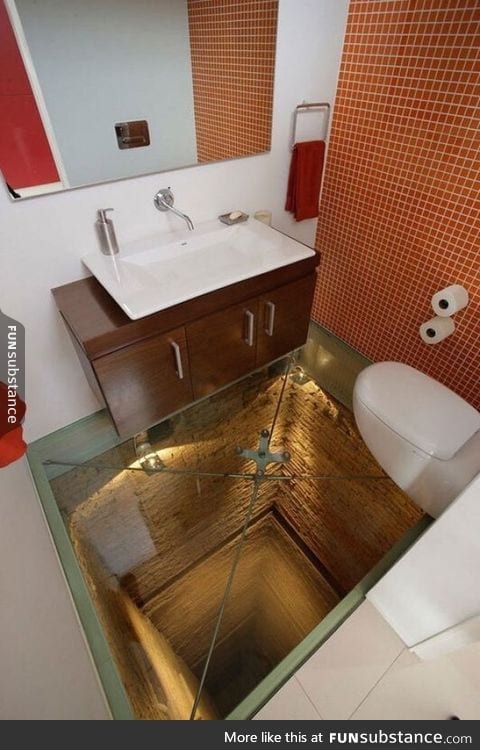 Bathroom with glass floor over an abandoned elevator shaft