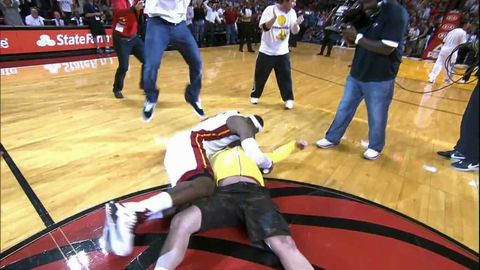 LeBron tackles Heat fan who hits $75,000 shot!