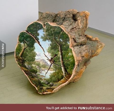 Landscape painted on the surface of a cut log