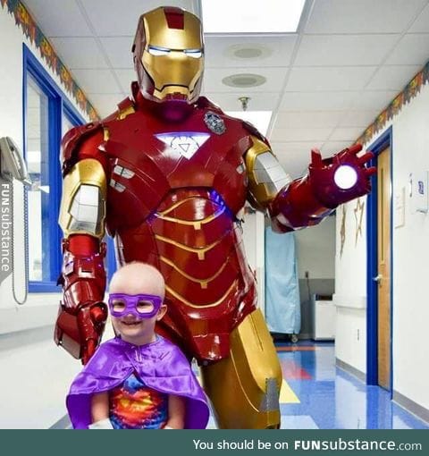 A cop dressed as Iron Man to visit a child with cancer. Absolutely heartwarming.