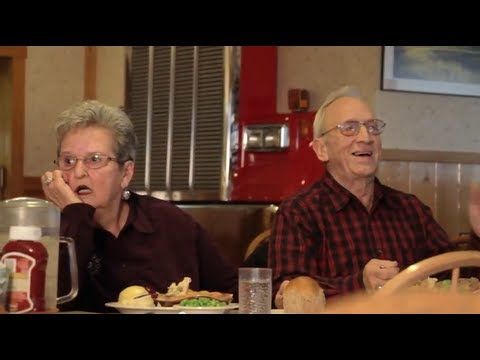 An elderly couple attempts to film a restaurant commercial. Hilarious outtakes emerge