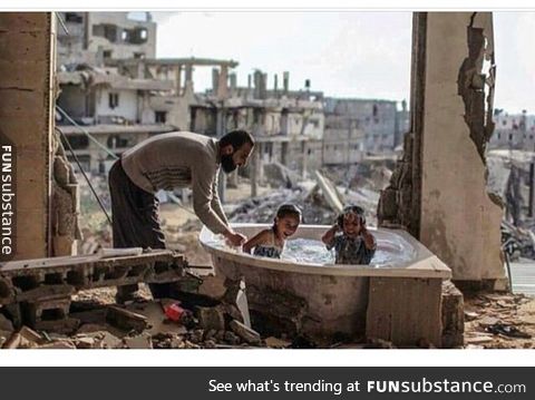 Happy kids in the middle of destruction...!!!
