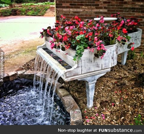 Old piano turned into a magnificent fountain