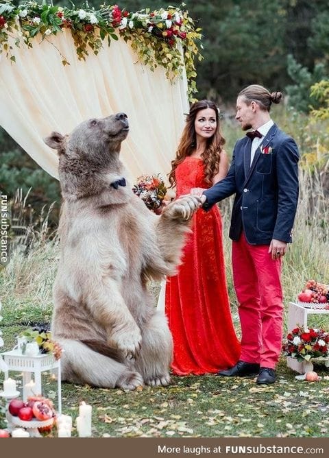 Russian couple getting married by a bear!