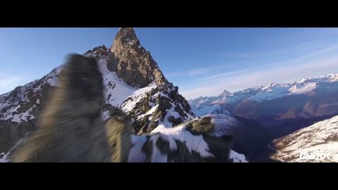 Guy risks his racing drone flying up a mountain. Gets rewarded with some beautiful footage