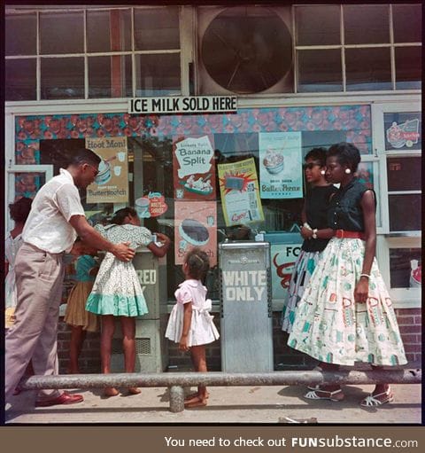 At a segregated drinking fountain, Mobile, Alabama, 1956. Photograph by Gordon Parks.