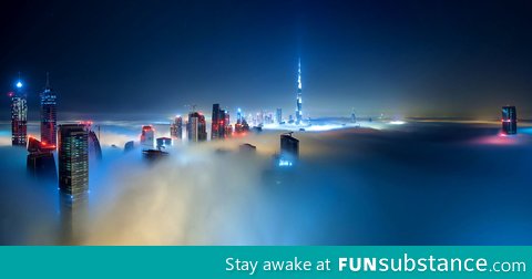 Dubai covered in fog by night