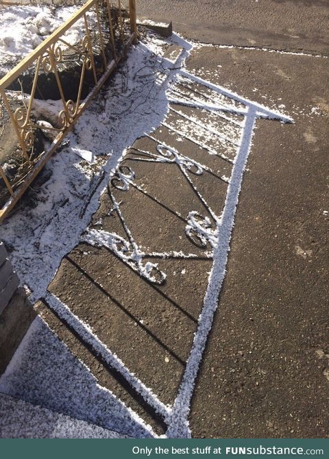 The fence's shadow prevented the snow from melting