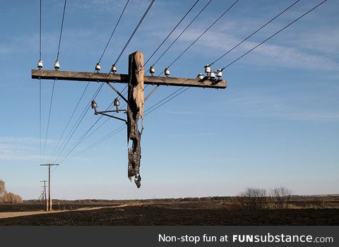 This electrical pole was left hanging after a wildfire