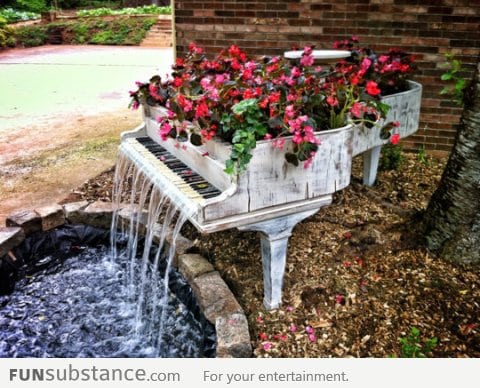 Old Piano Turned Into Outdoor Fountain