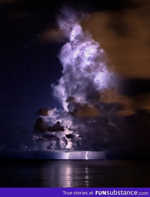 Cloud lit up by Lightning